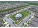 Aerial shot of community featuring well-maintained lawns, pool, and neighborhood streets at 1203 Custer Bayou Street, Ruskin, FL 33570