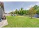 Large backyard with a playset, and well-maintained lawn at 1203 Custer Bayou Street, Ruskin, FL 33570