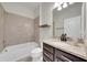 Bathroom featuring a vanity with granite countertops and a shower-tub combination at 1203 Custer Bayou Street, Ruskin, FL 33570