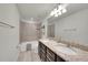 Bathroom with double granite vanity and tile shower and bathtub combo at 1203 Custer Bayou Street, Ruskin, FL 33570