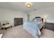 Comfortable bedroom with neutral walls and carpet flooring, showcasing a Queen bed at 1203 Custer Bayou Street, Ruskin, FL 33570