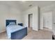 Cozy bedroom with a bed, closet, and neutral-toned carpet for relaxation at 1203 Custer Bayou Street, Ruskin, FL 33570