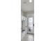 Bright foyer featuring built-in cabinets and drawers with a stylish glass-paneled door at 1203 Custer Bayou Street, Ruskin, FL 33570