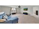 Comfortable living room with carpet, a large window, and modern decor at 1203 Custer Bayou Street, Ruskin, FL 33570