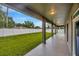 View of the backyard and a covered patio, perfect for entertaining or relaxing at 1229 Hillandale Reserve Dr, Tampa, FL 33613