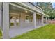 Covered back porch with recessed lights, columns, and a great view of the backyard at 1229 Hillandale Reserve Dr, Tampa, FL 33613