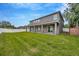 The spacious covered porch has recessed lights and a view of the large backyard at 1229 Hillandale Reserve Dr, Tampa, FL 33613