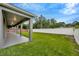 The covered back patio offers a relaxing area to enjoy the outdoor view and landscape at 1229 Hillandale Reserve Dr, Tampa, FL 33613