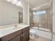 Bathroom featuring a sleek vanity and glass enclosed tub/shower at 1229 Hillandale Reserve Dr, Tampa, FL 33613