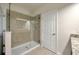 Modern tiled shower with glass enclosure in a bright bathroom, complemented by a tiled floor at 1229 Hillandale Reserve Dr, Tampa, FL 33613