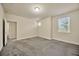 Inviting bedroom with natural light from two windows, plush carpeting and neutral paint at 1229 Hillandale Reserve Dr, Tampa, FL 33613