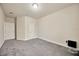 Large bedroom with plush carpet, neutral colored walls, and two entryways offers versatility in living space at 1229 Hillandale Reserve Dr, Tampa, FL 33613