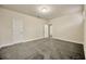 Bedroom with large floor, open doors, and neutral color scheme at 1229 Hillandale Reserve Dr, Tampa, FL 33613