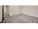 Expansive bedroom with light gray carpet and multiple doorways at 1229 Hillandale Reserve Dr, Tampa, FL 33613