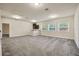 Expansive bonus room featuring neutral carpet, wet bar, and plenty of natural lighting at 1229 Hillandale Reserve Dr, Tampa, FL 33613