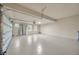 Spacious two car garage with an automatic door and epoxy flooring at 1229 Hillandale Reserve Dr, Tampa, FL 33613