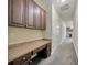 Hallway with a built-in desk and cabinets leading towards an additional room at 1229 Hillandale Reserve Dr, Tampa, FL 33613