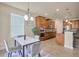 Open-concept kitchen and dining area with updated appliances and a stylish dining table at 1229 Hillandale Reserve Dr, Tampa, FL 33613