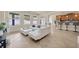 Bright living room with backyard views, neutral décor, and breakfast bar access at 1229 Hillandale Reserve Dr, Tampa, FL 33613