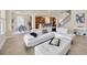 Spacious living room showcasing an open floor plan with seamless access to the dining and kitchen areas at 1229 Hillandale Reserve Dr, Tampa, FL 33613