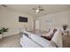 Cozy living room offers a ceiling fan, tile flooring, and comfortable seating area with lots of natural light at 1229 Hillandale Reserve Dr, Tampa, FL 33613