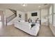 Inviting living room featuring a staircase, neutral decor, and tile flooring at 1229 Hillandale Reserve Dr, Tampa, FL 33613