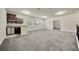 Open-concept living room with kitchenette, featuring modern appliances and natural light at 1229 Hillandale Reserve Dr, Tampa, FL 33613