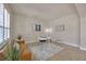 Bright sitting area with shuttered windows, sofa, modern desk and chair, and neutral wall color at 1229 Hillandale Reserve Dr, Tampa, FL 33613
