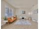 Sitting area with shutters, sofa, desk and chair, area rug, and modern artwork at 1229 Hillandale Reserve Dr, Tampa, FL 33613