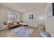 Bright sitting area with desk, modern decor, and natural light from shuttered windows at 1229 Hillandale Reserve Dr, Tampa, FL 33613
