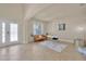 Bright sitting area, arched entry, shuttered window, desk and chair, and modern art at 1229 Hillandale Reserve Dr, Tampa, FL 33613