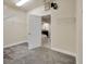 Spacious walk-in closet with shelving, leading to an en-suite bathroom with soaking tub at 1229 Hillandale Reserve Dr, Tampa, FL 33613