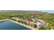 A scenic aerial view showcasing the property's proximity to a lake and lush greenery at 12353 Bayou Flats Ln, Tampa, FL 33635