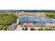 Aerial showcasing this townhome community's location by a lake with fountains at 12353 Bayou Flats Ln, Tampa, FL 33635