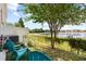 Peaceful backyard area featuring an outdoor lounge area, a lake, and lush greenery at 12353 Bayou Flats Ln, Tampa, FL 33635