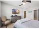 Comfortable bedroom featuring stylish furnishings, a ceiling fan, and a TV at 12353 Bayou Flats Ln, Tampa, FL 33635
