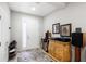 Bright foyer features white walls, wood-look tile, and an ornate accent table at 12353 Bayou Flats Ln, Tampa, FL 33635