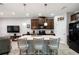 Open kitchen with a large center island, stainless steel appliances, and barstool seating at 12353 Bayou Flats Ln, Tampa, FL 33635