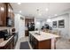 Stylish kitchen with modern appliances, island with seating, and warm wood cabinetry at 12353 Bayou Flats Ln, Tampa, FL 33635