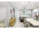 Open-concept living space with wood-look tile and an abundance of natural light at 12353 Bayou Flats Ln, Tampa, FL 33635