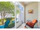 Relaxing patio with seating, offering a serene view of the lake at 12353 Bayou Flats Ln, Tampa, FL 33635