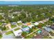 Aerial view overlooking the residential area with the ocean in the distance at 1263 Overcash Dr, Dunedin, FL 34698