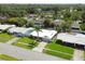 Aerial view showcasing the property's location with a lush, green landscape at 1263 Overcash Dr, Dunedin, FL 34698