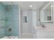Modern bathroom showcasing a sleek vanity, stylish tiles, and glass shower at 1263 Overcash Dr, Dunedin, FL 34698