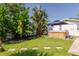A covered hot tub in a lush backyard provides a private and serene space for relaxation at 1263 Overcash Dr, Dunedin, FL 34698