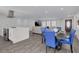 Open living space with a modern kitchen, a dining area, and a comfortable living room, perfect for entertaining guests at 1263 Overcash Dr, Dunedin, FL 34698