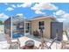 Cozy backyard with screened in patio, fire pit area, and ample room for fun and entertaining at 12925 Fieldmoor Ct, Riverview, FL 33579