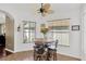Bright breakfast nook with ceiling fan and large windows providing natural light at 12925 Fieldmoor Ct, Riverview, FL 33579