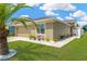 Beautiful single-story home featuring well-manicured lawn and tidy landscaping around the foundation at 12925 Fieldmoor Ct, Riverview, FL 33579