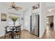Bright kitchen nook with stainless steel refrigerator and space for a breakfast table at 12925 Fieldmoor Ct, Riverview, FL 33579